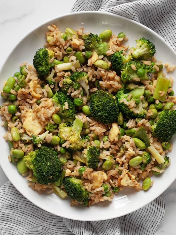 Broccoli, pea and edamame fried rice on a plate.