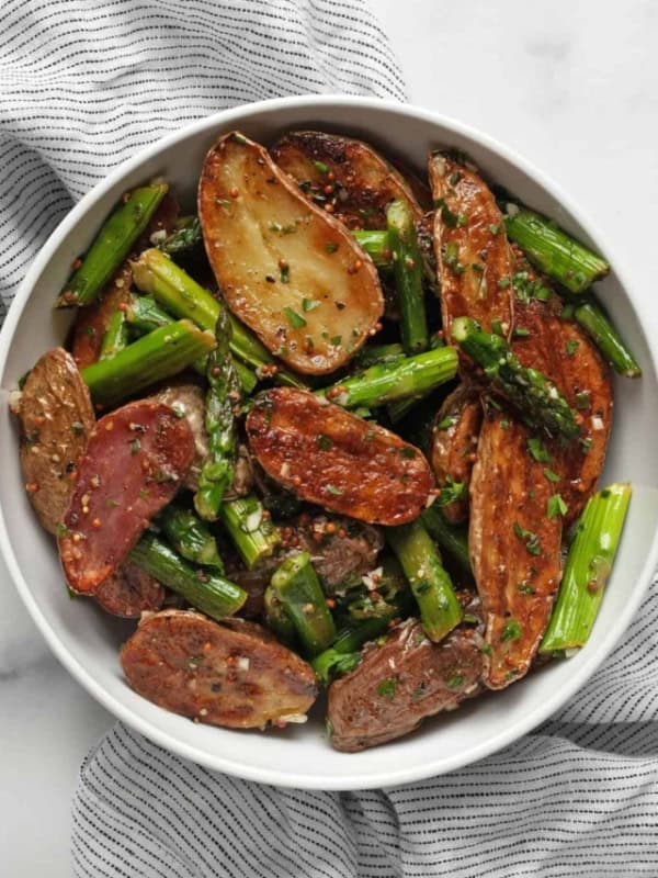Roasted asparagus potato salad in a bowl.