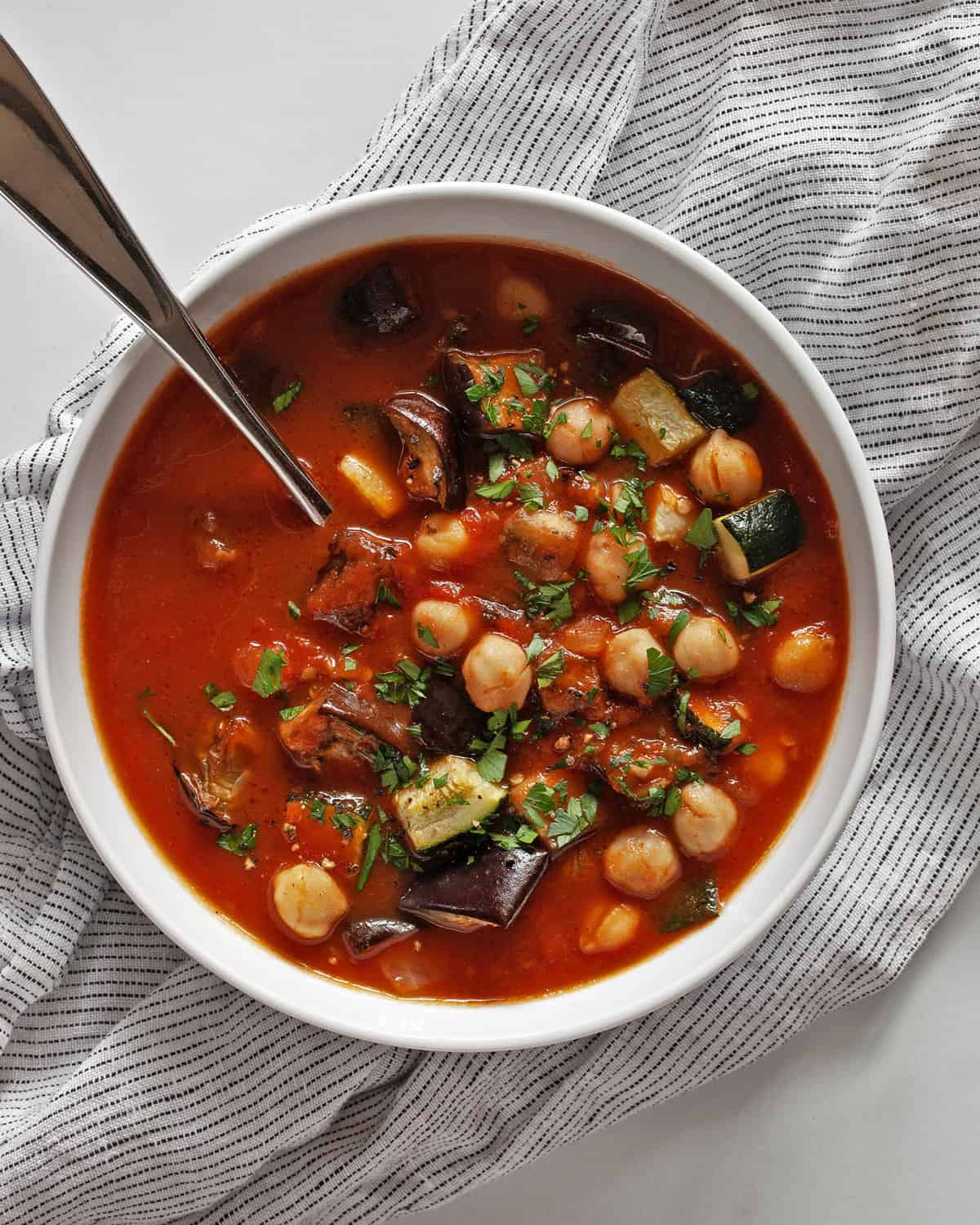 Bowl of zucchini tomato eggplant soup.