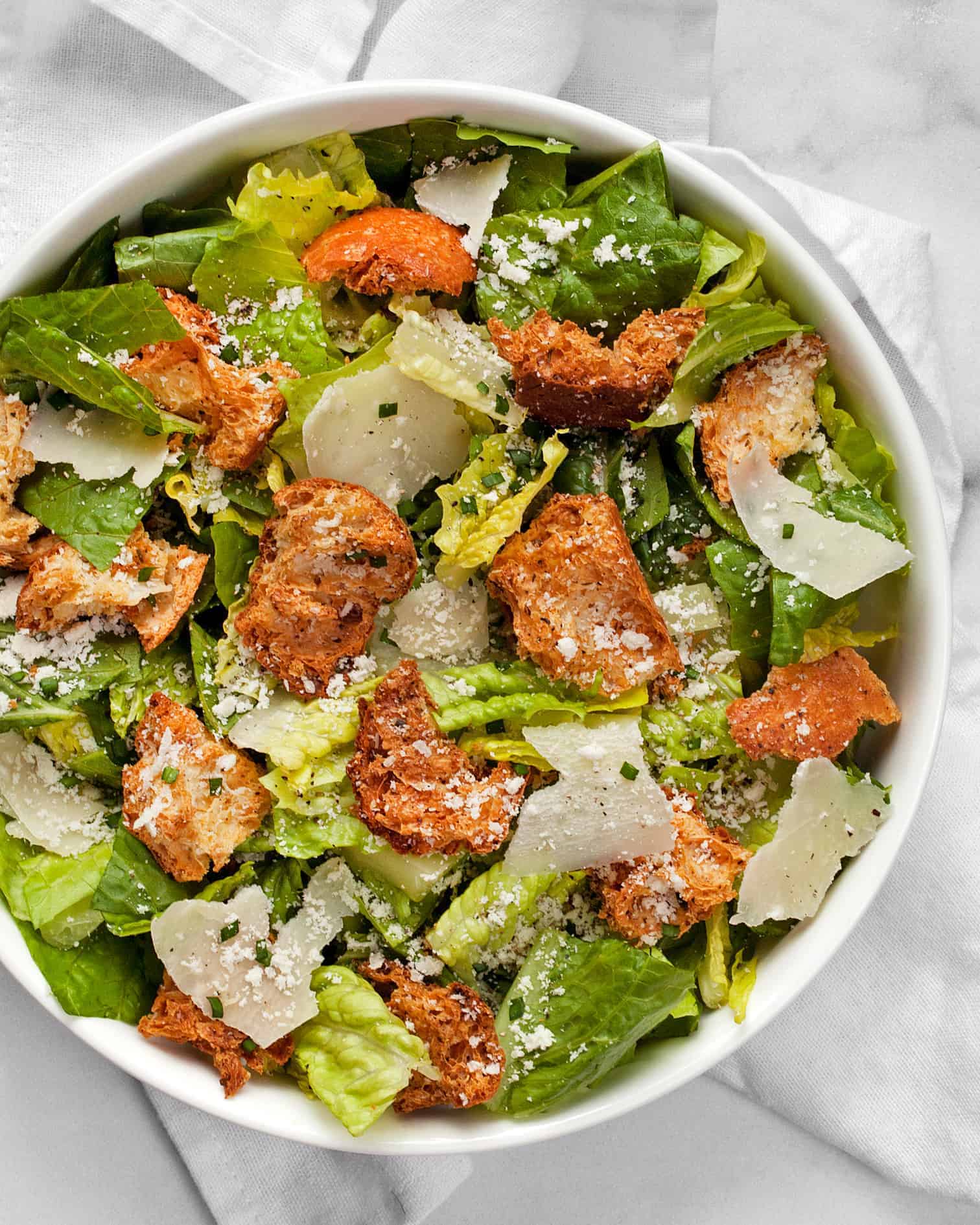 Romaine salad with croutons and Parmesan cheese.