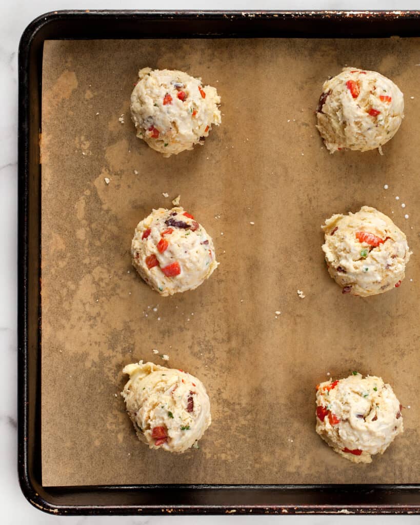 Portion out the biscuit dough on sheet pan