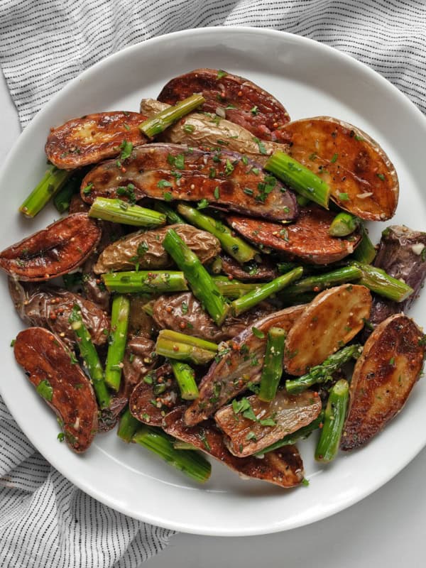 Roasted asparagus potato salad on a plate.