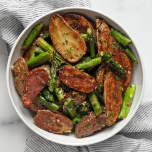 Roasted asparagus potato salad in a bowl.