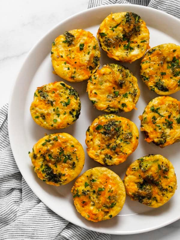 Broccoli cheddar frittatas on a plate.