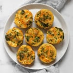 Broccoli cheddar frittatas on a plate.