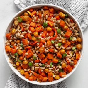 Farro with roasted carrots and chickpeas in a bowl.