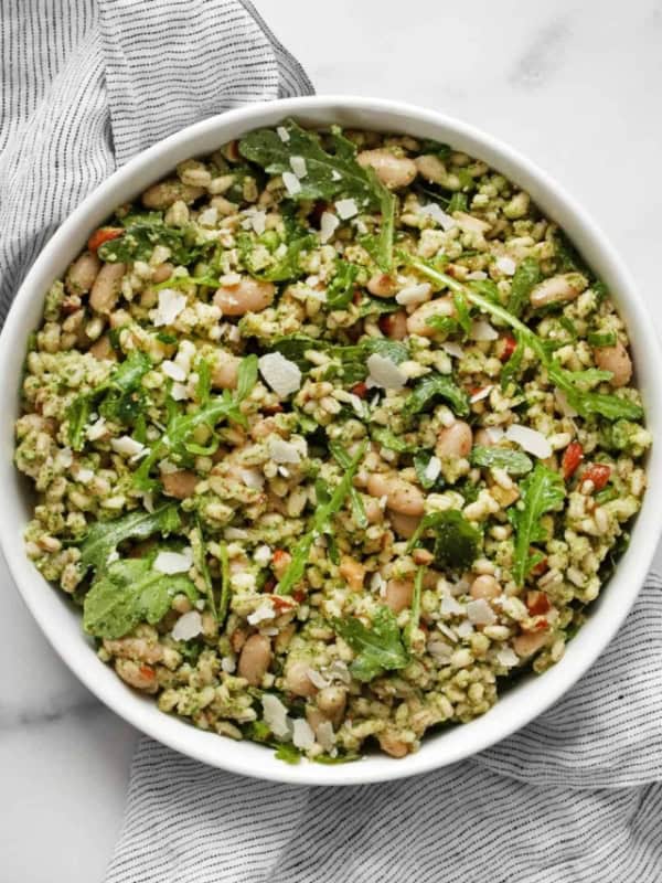 Cannellini bean barley with arugula pesto in a bowl.