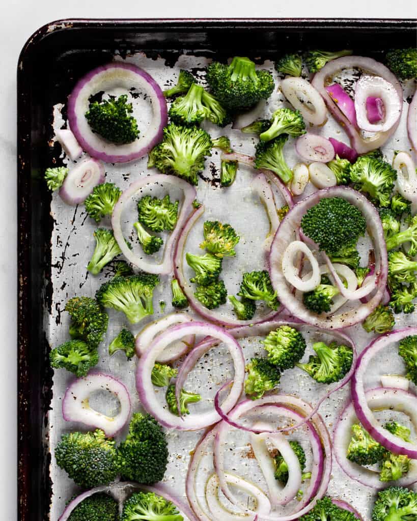 Broccoli and red onions on sheet pan