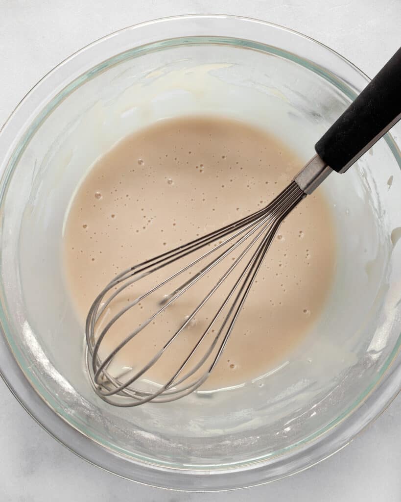 Whisking the glaze for the scones
