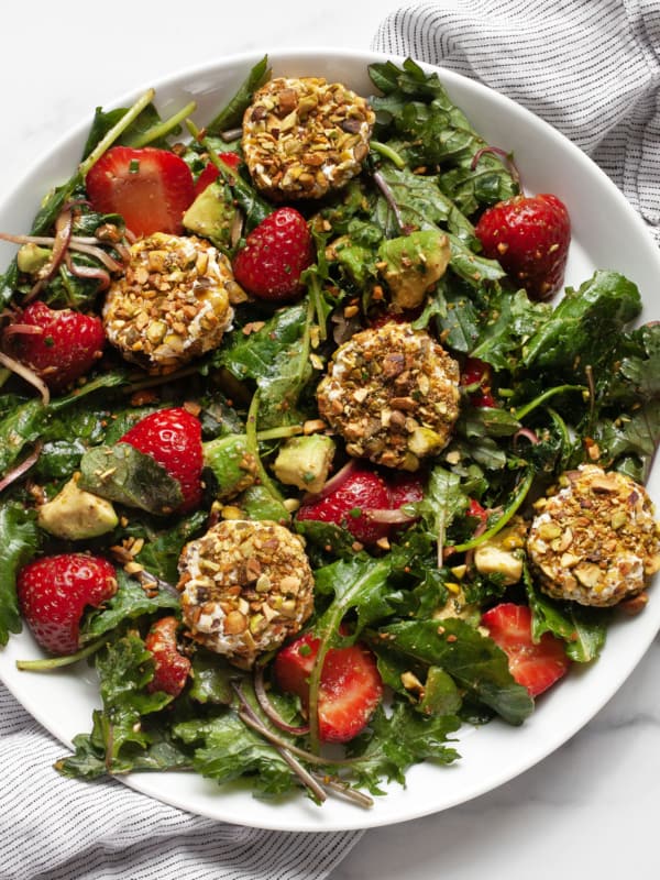 Strawberry goat cheese salad on a plate.