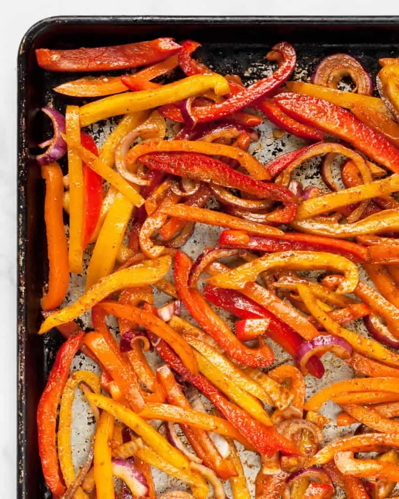 Peppers and onions on a sheet pan