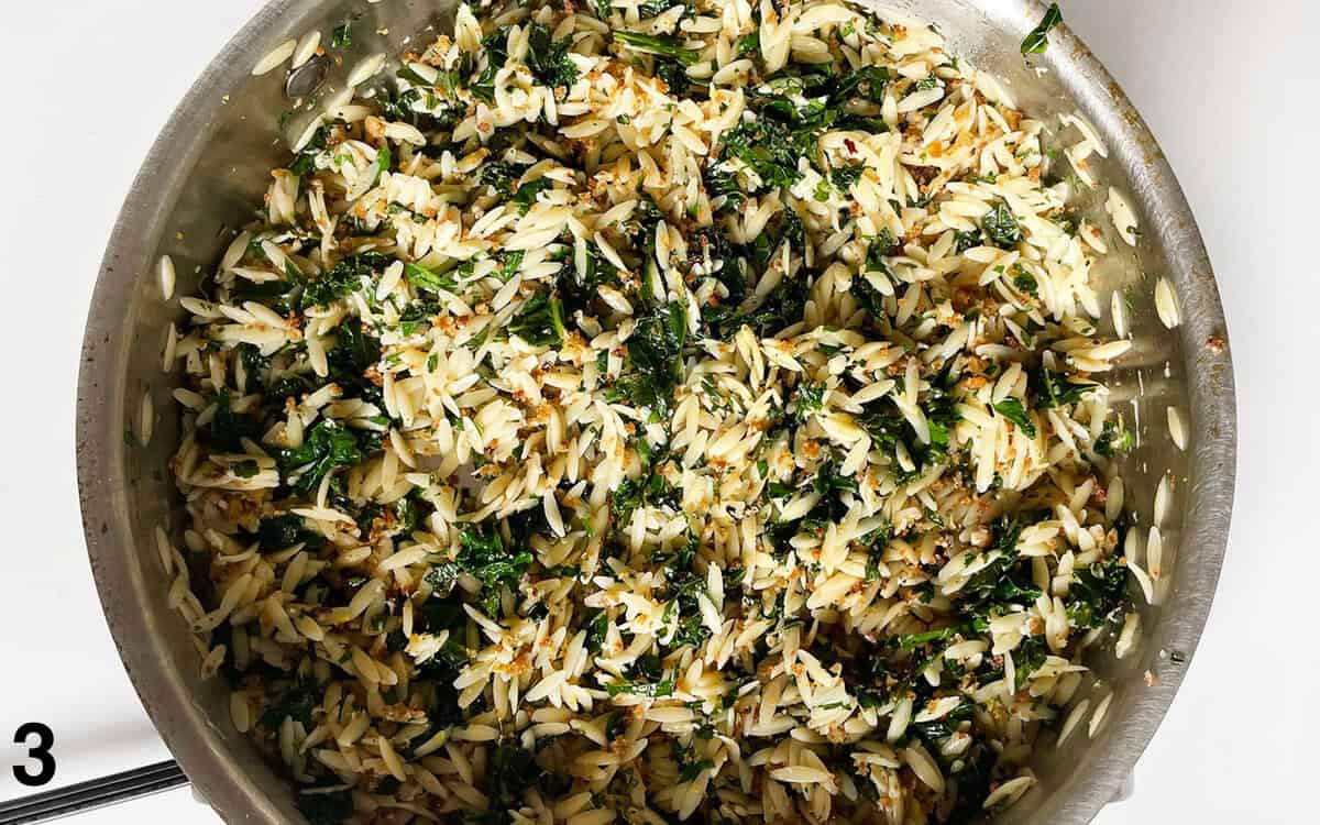 Finished lemon orzo in a skillet.