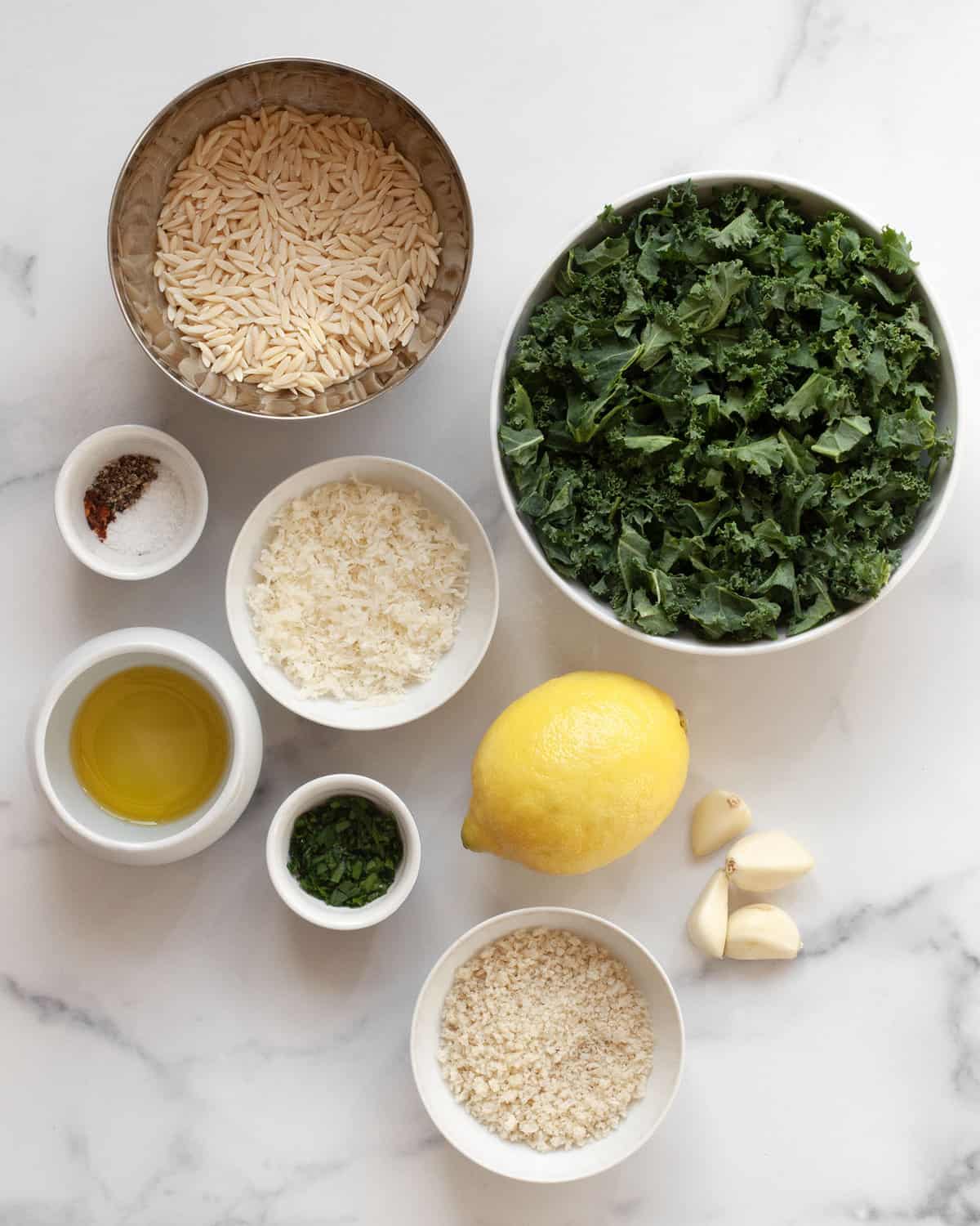 Ingredients including lemon, kale, orzo, breadcrumbs, olive oil, pecorino, parsley and spices.
