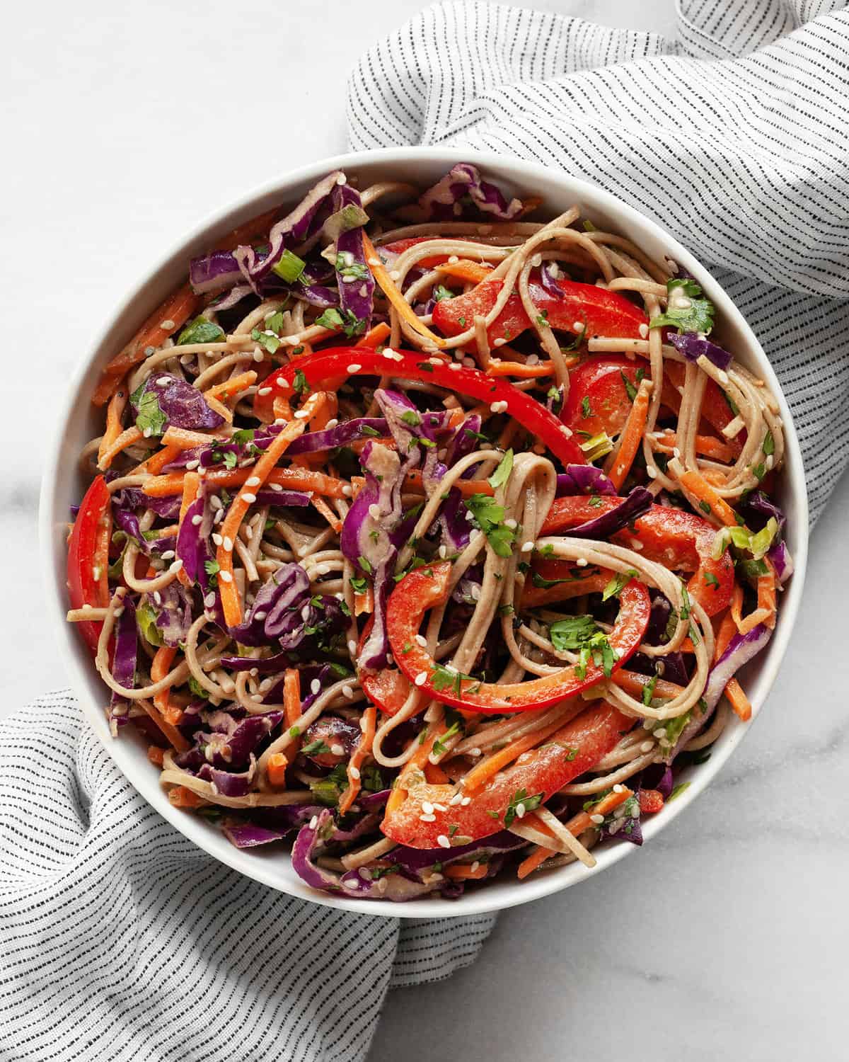 Soba noodle salad in a small bowl.