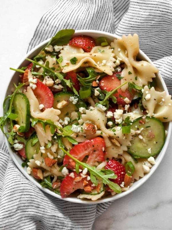 Strawberry cucumber pasta salad in a small bowl.