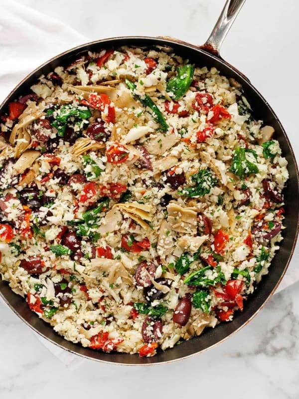 Tomato Olive Artichoke Cauliflower Rice in a Skillet