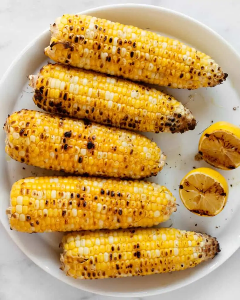 Grilled corn cobs and lemon