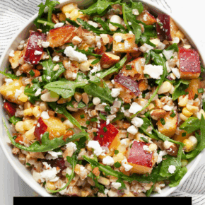 Peach corn farro salad in a bowl.