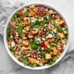 Peach corn farro salad in a bowl.