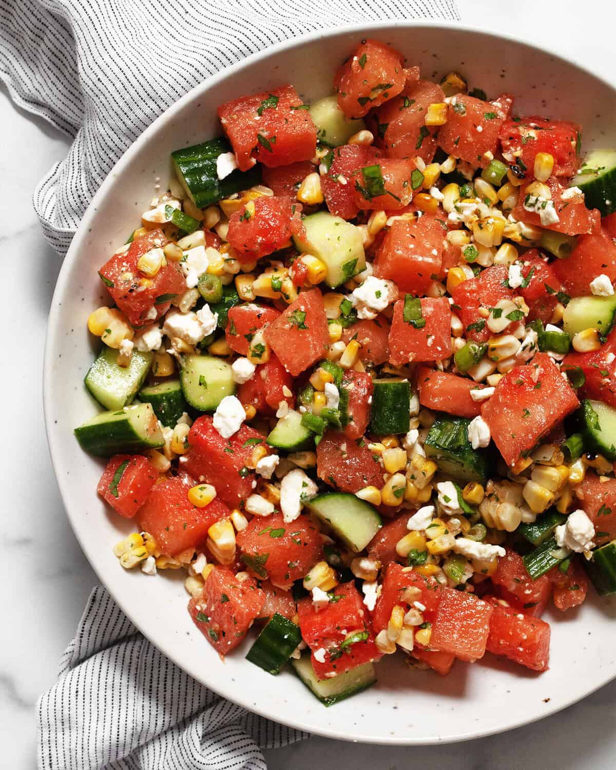 Watermelon cucumber salad in a bowl.
