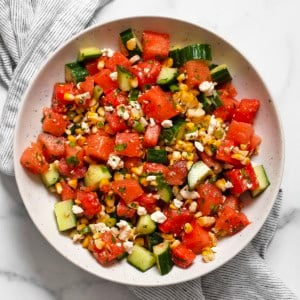Watermelon cucumber corn salad in a bowl.