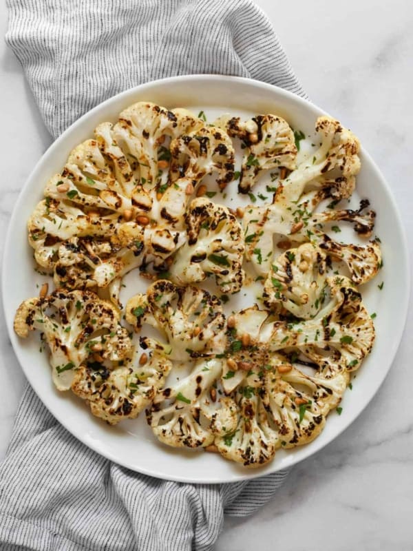 Grilled cauliflower on a plate.