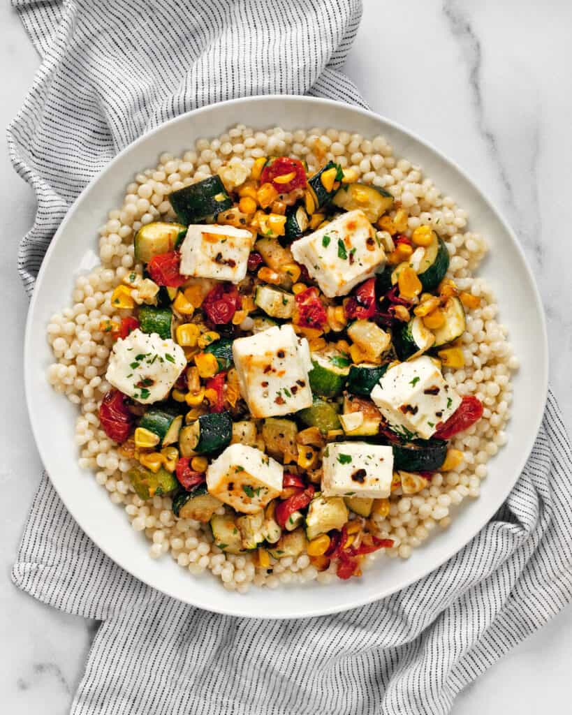 Baked Feta With Roasted Vegetables and Pearl Couscous