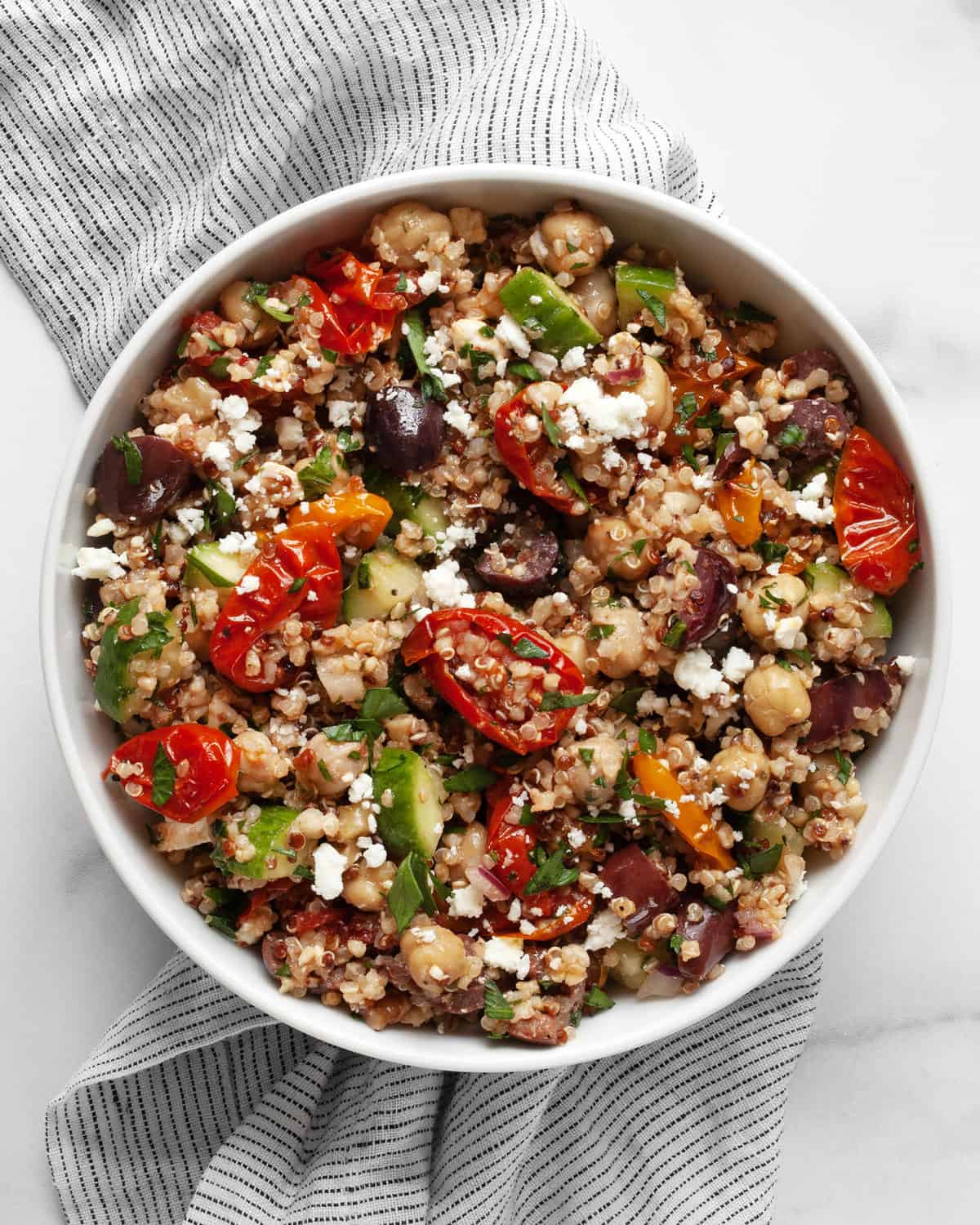 Quinoa chickpea salad in a small bowl.