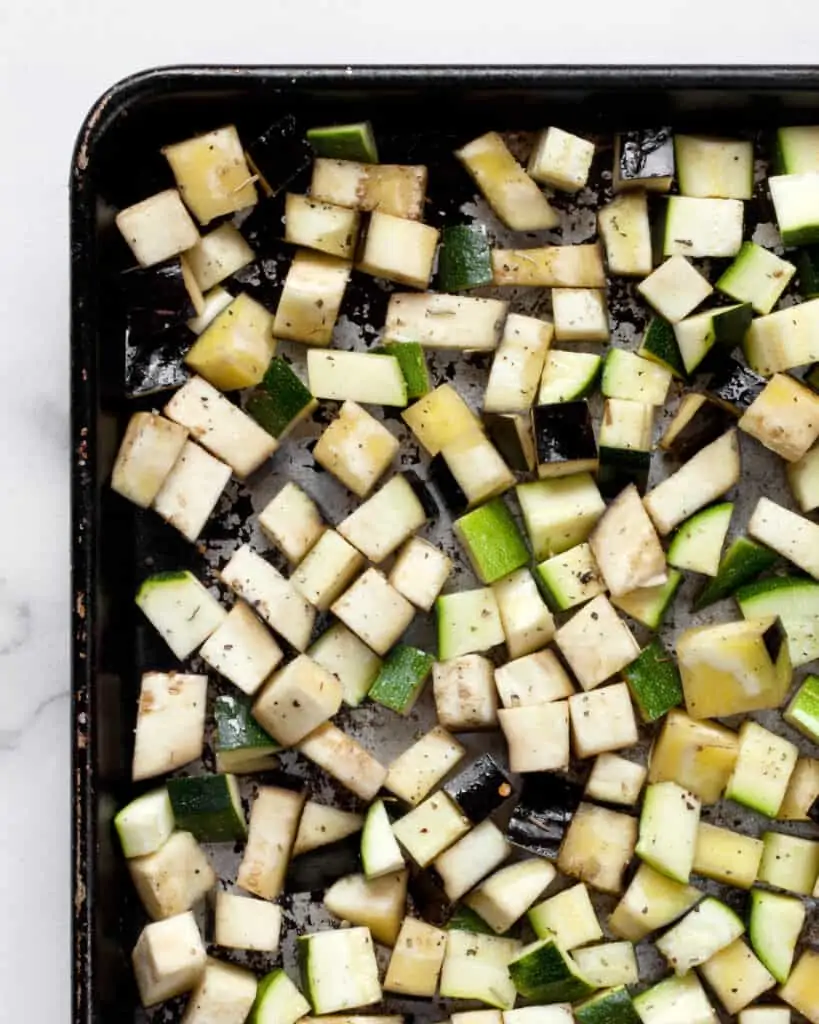 Diced zucchini and eggplant on a sheet pan