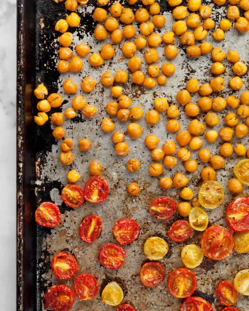 Roasted tomatoes and chickpeas on a sheet pan