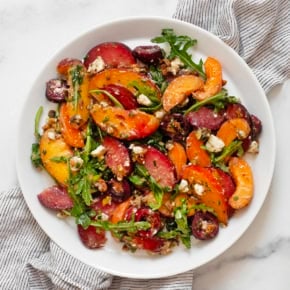 Stone fruit salad on a plate.