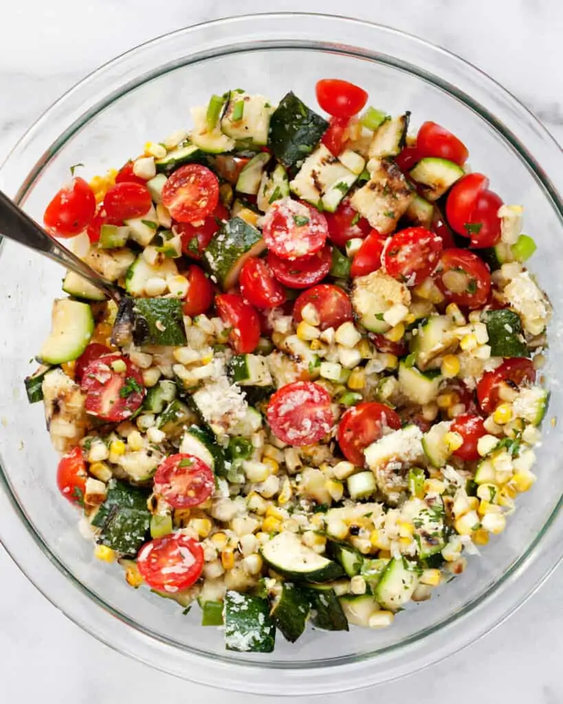 Stirring together the salad ingredients