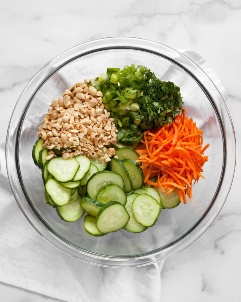 Cucumber salad ingredients in a bowl