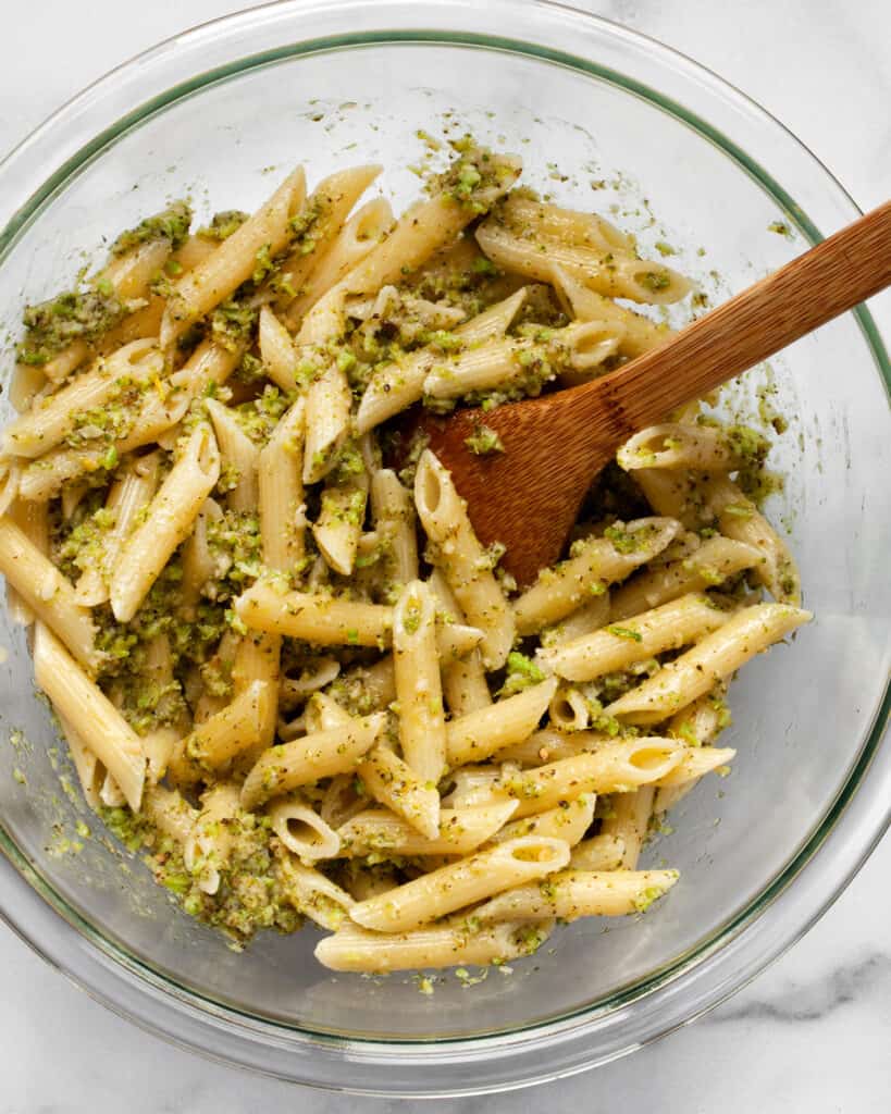 Stirring pesto into pasta