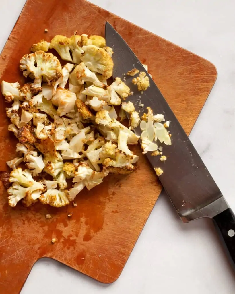 Chopping roasted cauliflower