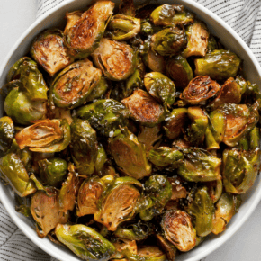 Spicy roasted brussels sprouts on a plate.
