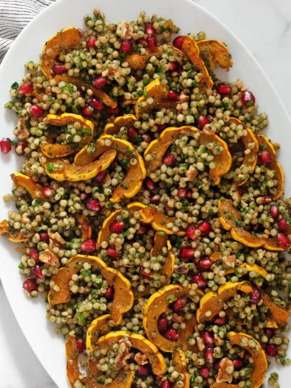 Roasted delicata squash couscous on a serving platter.