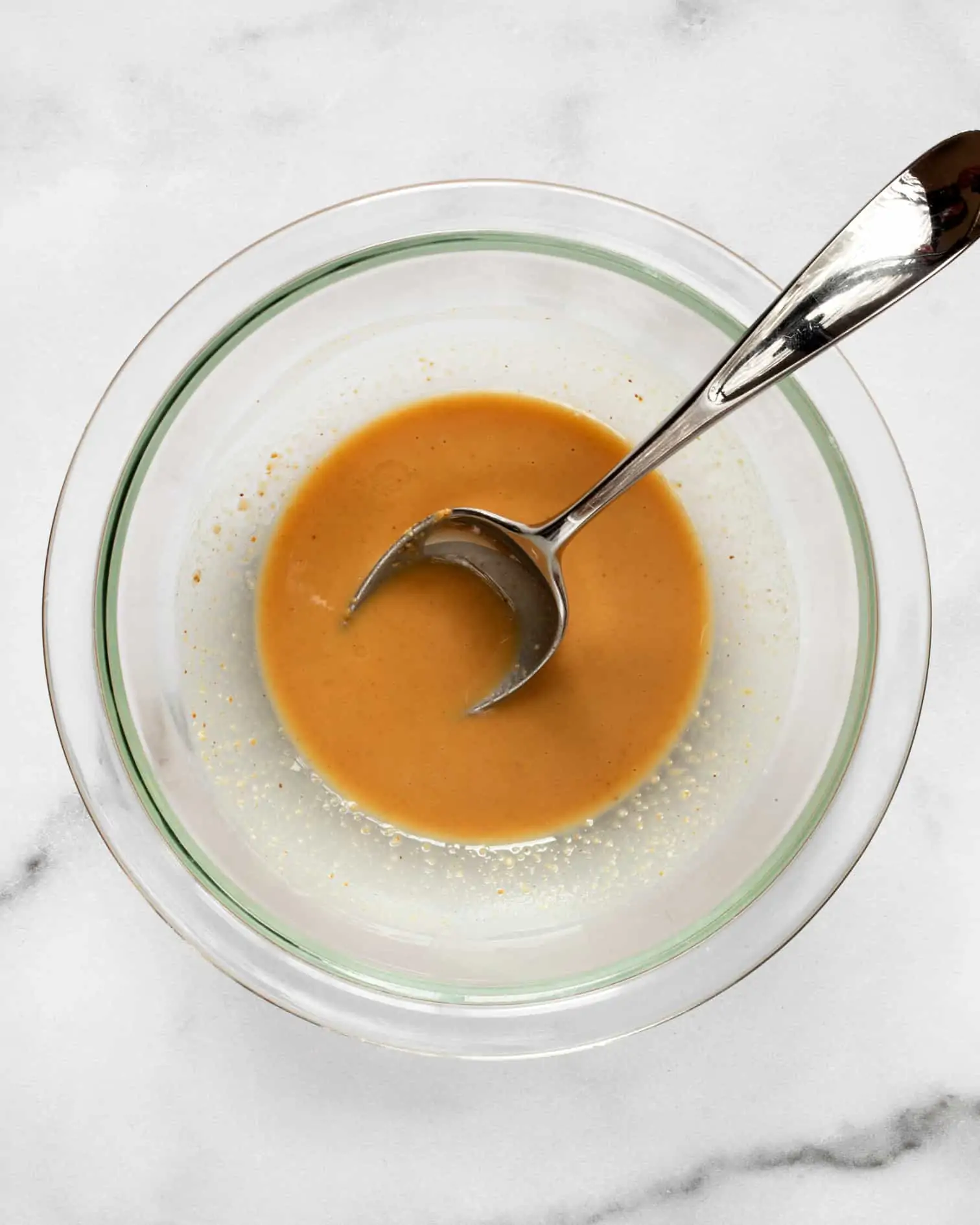 Stir together the melted coconut oil and peanut butter
