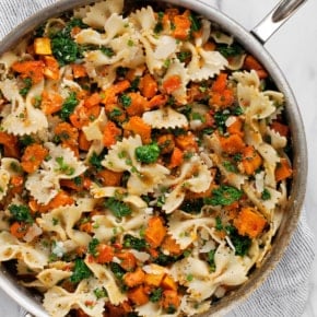 Squash pasta in a skillet.