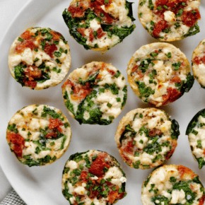 Baked spinach feta egg cups on a plate.