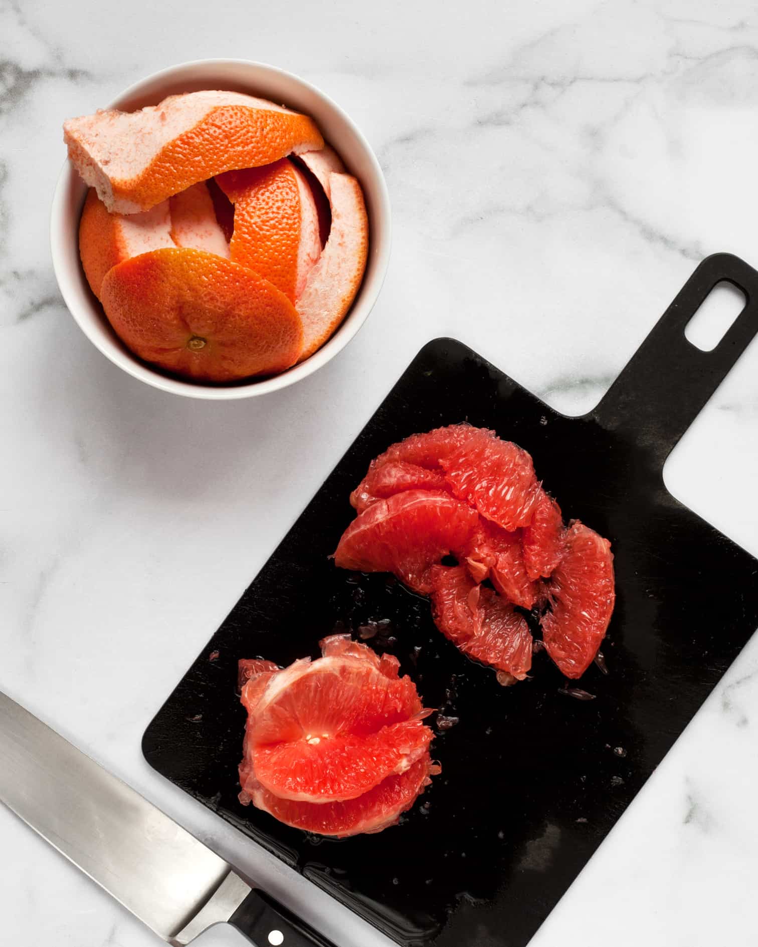 Peeling and cutting the segments from grapefruit