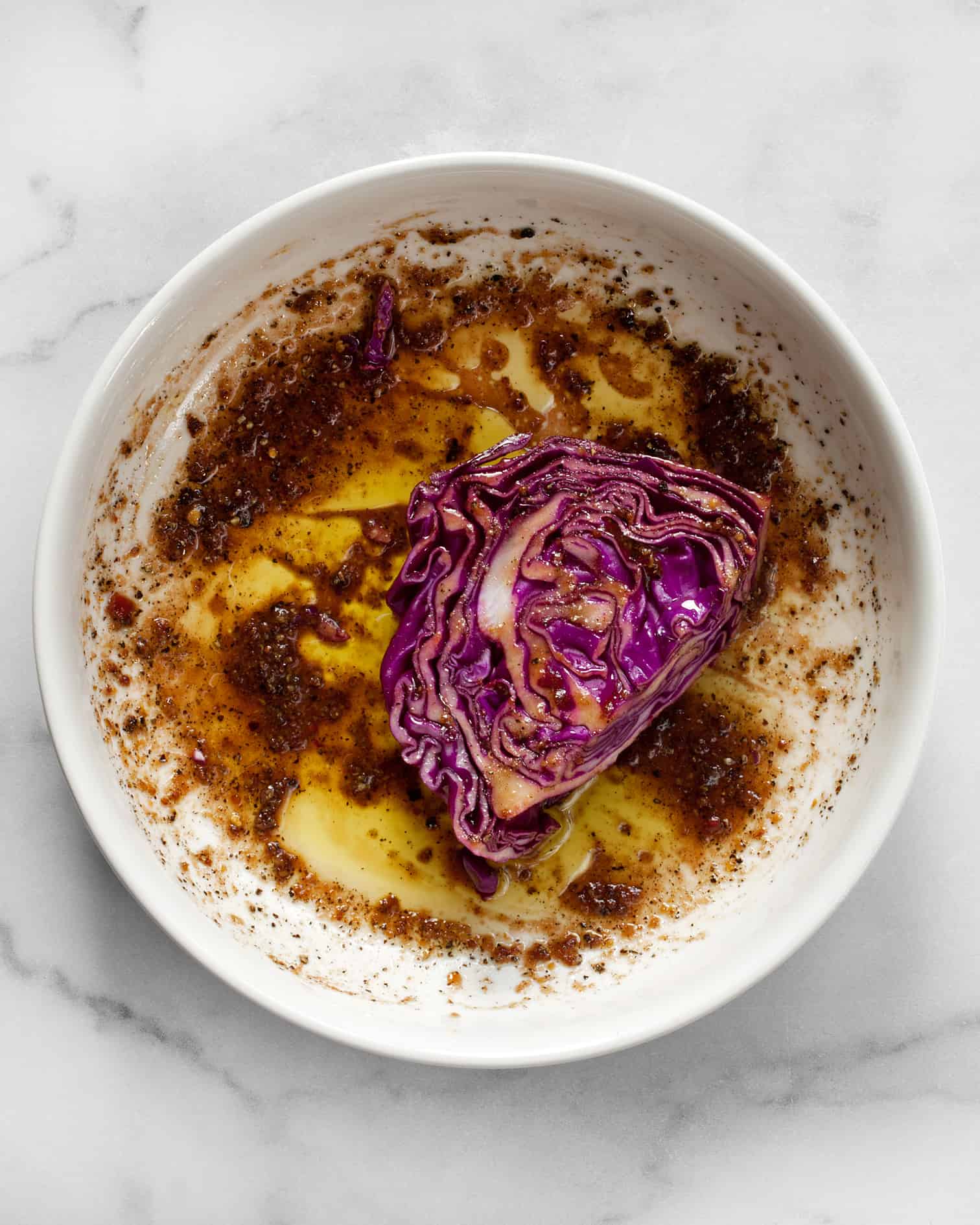 Dip each cabbage slice into the bowl of marinade