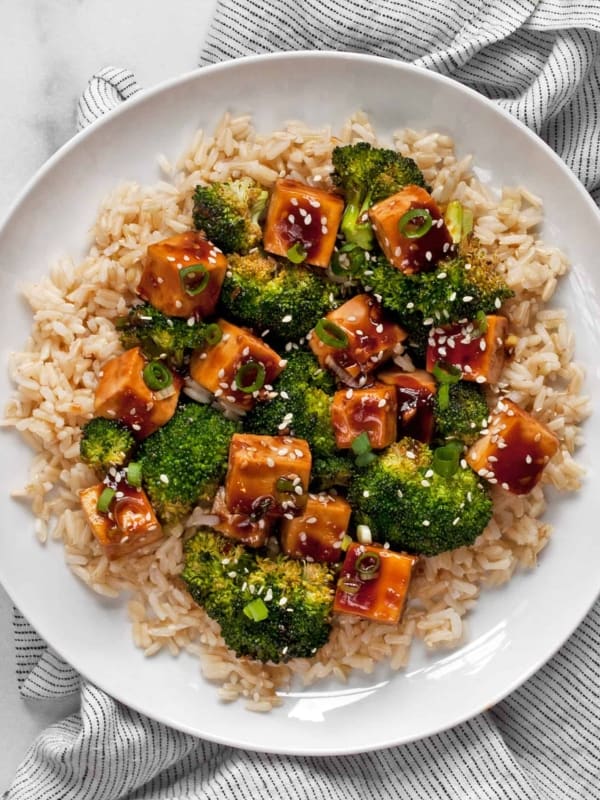Honey garlic tofu with broccoli and brown rice on a plate