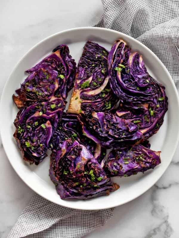 Slices of roasted red cabbage on a plate.