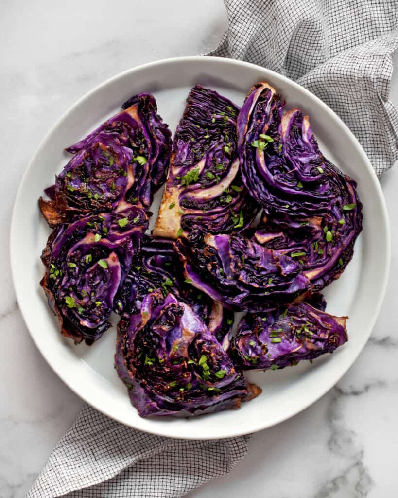 Slices of roasted red cabbage on a plate.