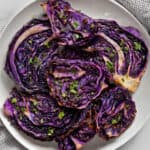 Slices of roasted red cabbage on a plate.