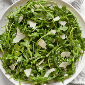 Arugula salad on a plate.