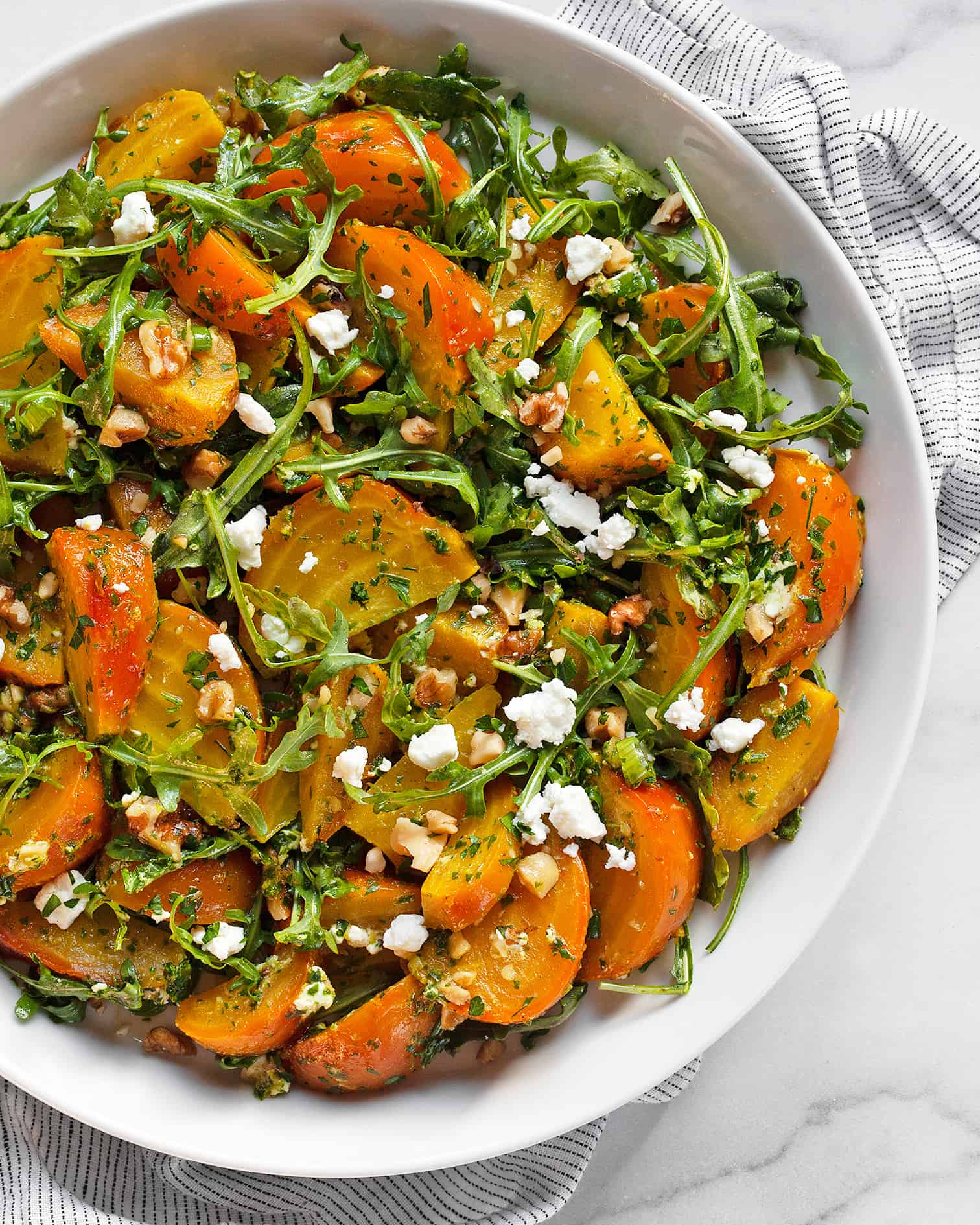 Roasted golden beet salad on a plate.