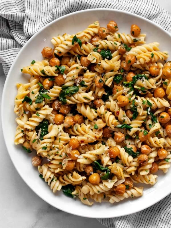 Chickpea pasta with spinach on a plate.