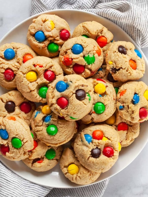 Peanut butter M&M cookies on a plate.